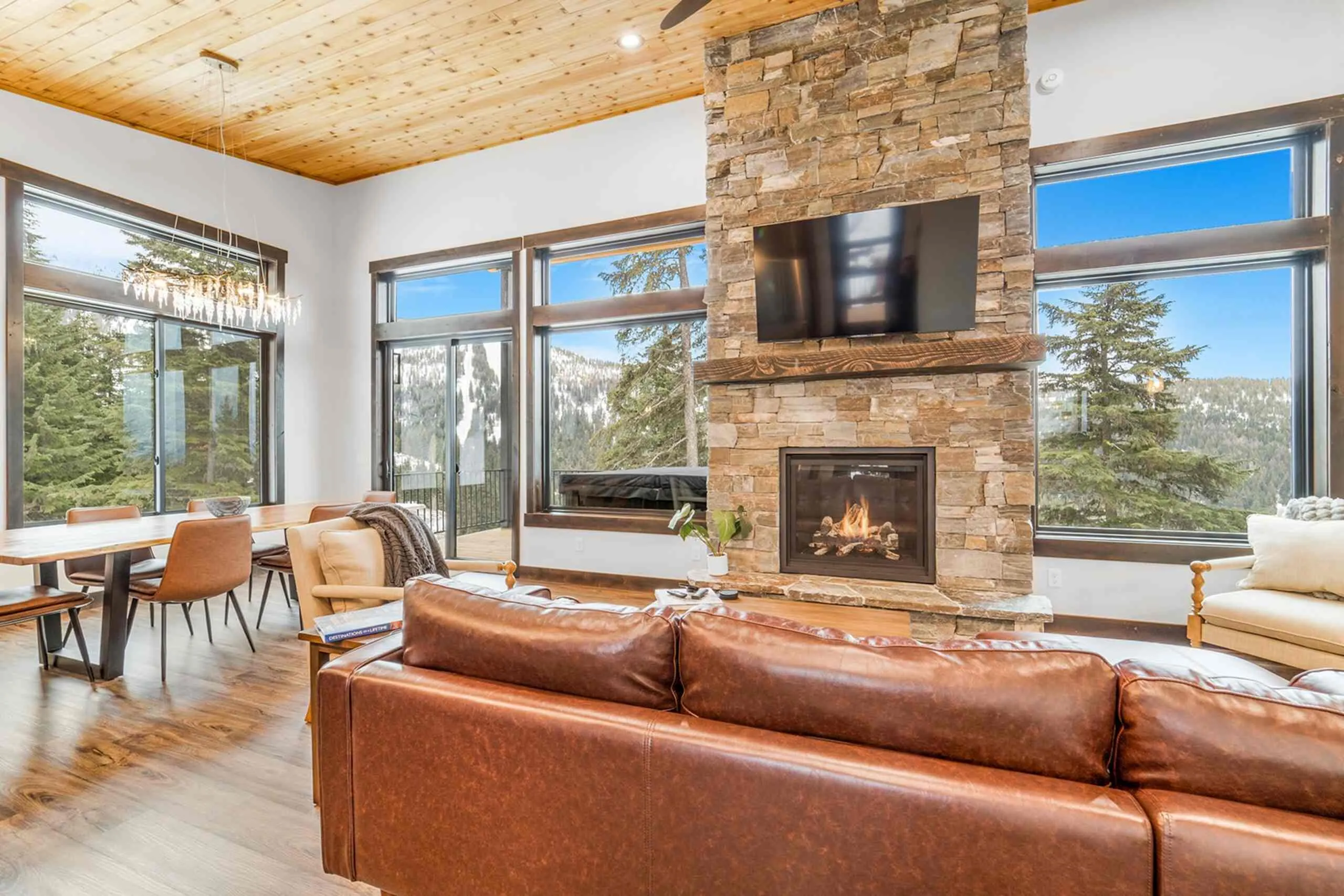 North Lodge living and dining room with stone fireplace